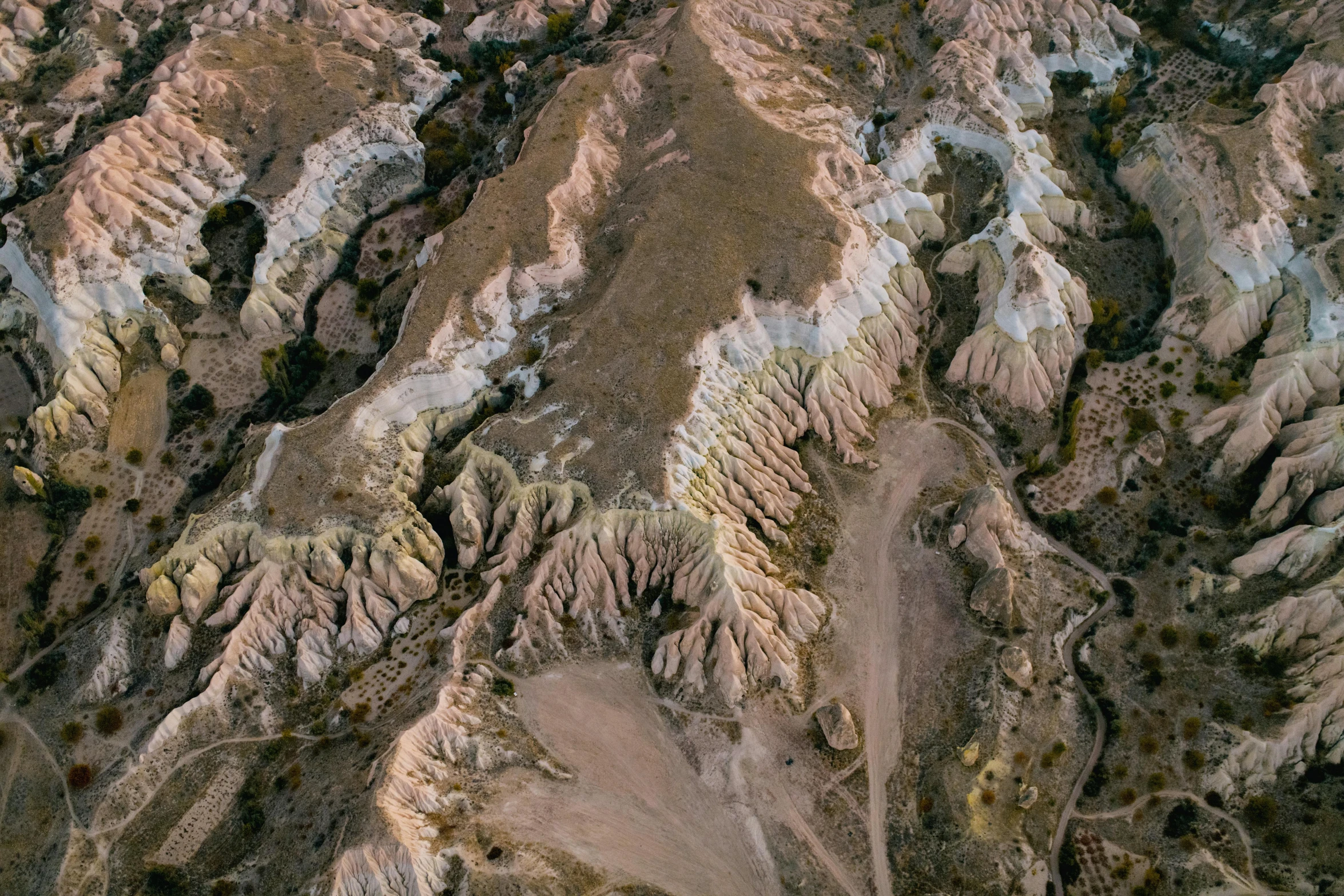 an aerial view of a mountain range in the desert, an ultrafine detailed painting, by Ibrahim Kodra, unsplash contest winner, pamukkale, structural geology, photogrammetry, taken in the early 2020s
