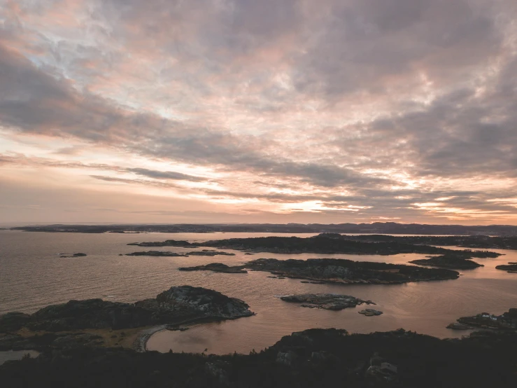 a large body of water surrounded by land, by Jesper Knudsen, pexels contest winner, archipelago, evening time, view from the top, thumbnail