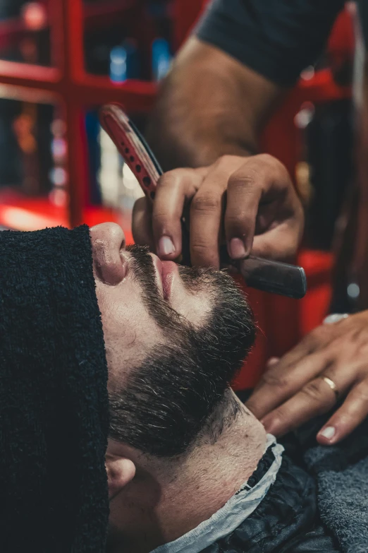 a man getting his hair cut at a barber shop, trending on pexels, square masculine jaw, ilustration, makeup, lumberjack