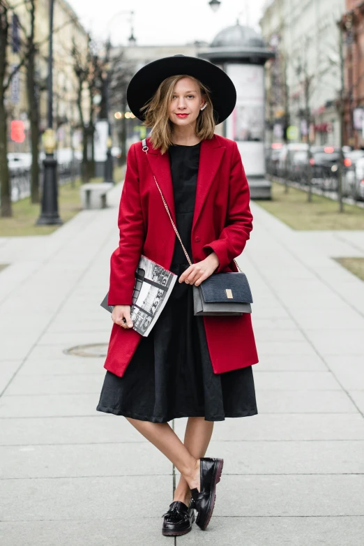 a woman wearing a red coat and black hat, by Julia Pishtar, midi skirt, half - length photo, rectangle, 8 l