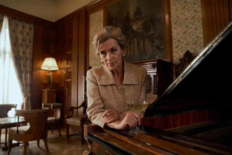 a woman sitting at a piano with a glass of wine, the iron lady, academy headmaster, square, **cinematic