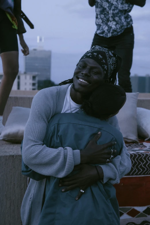 a couple of people standing on top of a roof, an album cover, trending on unsplash, happening, hugging, chief keef, still from a music video, 15081959 21121991 01012000 4k