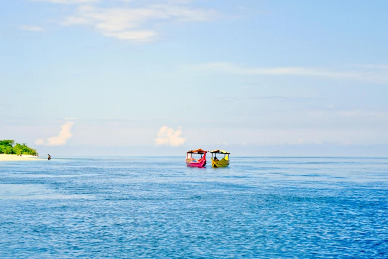 a small boat in the middle of a large body of water, turquoise pink and yellow, one small boat, blue ocean, conde nast traveler photo