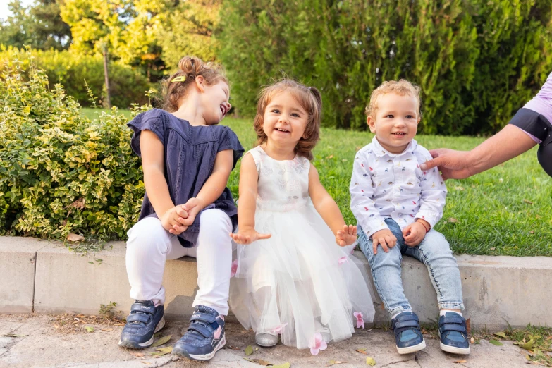 a group of young children sitting next to each other, by Alexander Fedosav, pexels, 15081959 21121991 01012000 4k, sitting in the rose garden, high quality details, 2 years old