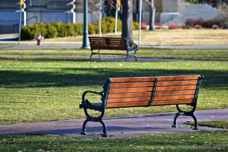 a park bench sitting in the middle of a park, inspired by Washington Allston, 2019 trending photo, wyoming, square, benches