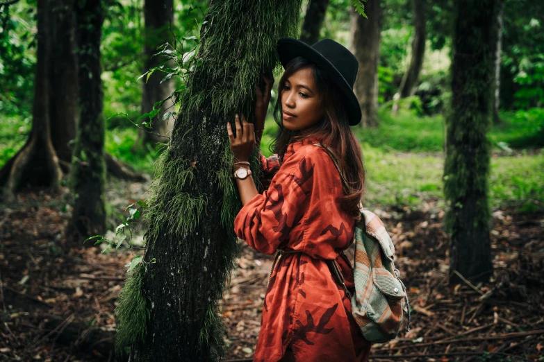 a woman standing next to a tree in a forest, a portrait, by Julia Pishtar, sumatraism, stylish, avatar image