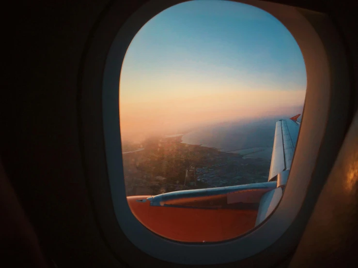 a view out of an airplane window at sunset, renaissance, lofi, fan favorite, flying aircrafts, birdeye