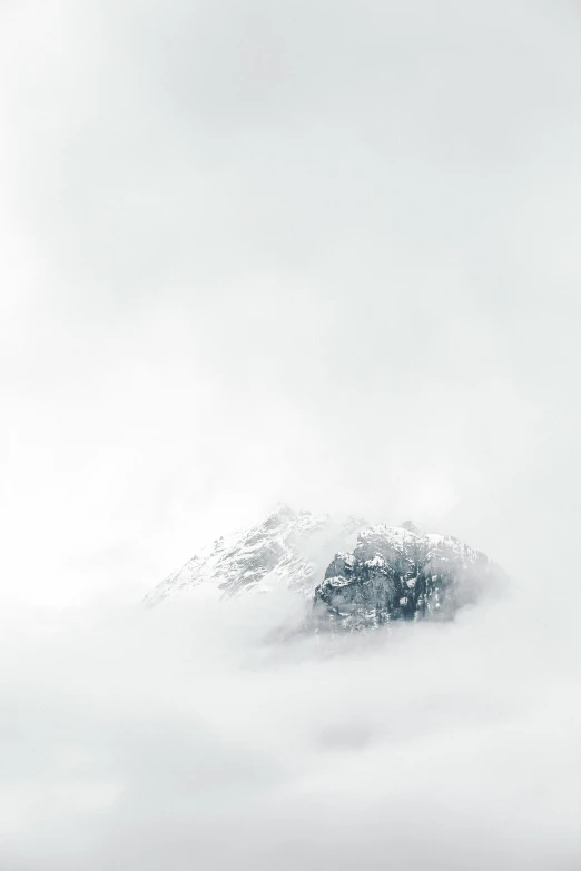 a group of people riding skis on top of a snow covered slope, an album cover, by Matthias Weischer, unsplash contest winner, mysterious fog, white veil, peak, covered in