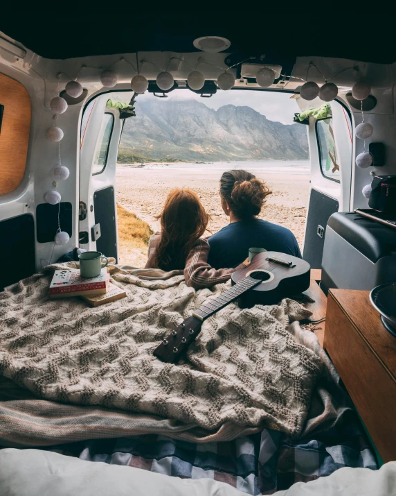 a couple of people sitting on top of a bed in a van, by Lucia Peka, trending on unsplash, romantic lead, multiple stories, snacks, music