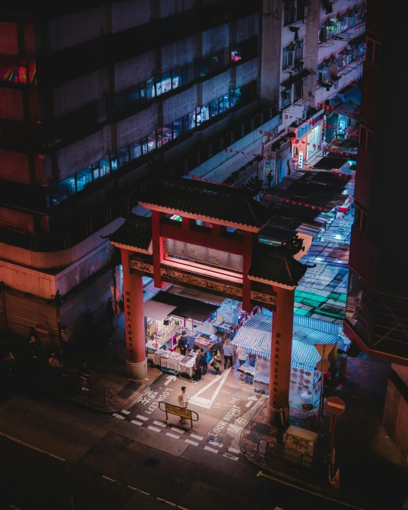 an overhead view of a city street at night, inspired by Liam Wong, pexels contest winner, mingei, chinese temple, an archway, seen from outside, deserted shinjuku junk