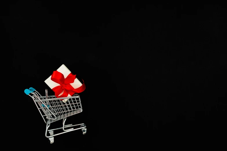 a shopping cart with a gift in it, pexels contest winner, bauhaus, black backdrop, background image, drone photo, 9