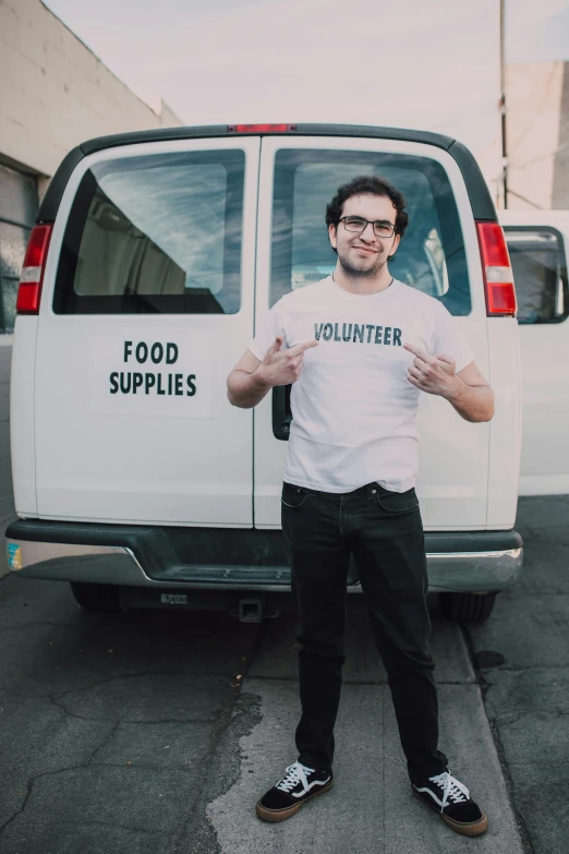 a man standing in front of a white van, by Francis Helps, food, kailee mandel, pro - vida, no logo