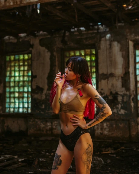 a woman in a bikini smoking a cigarette, inspired by Elsa Bleda, pexels contest winner, graffiti, standing in abandoned building, black and red hair, gif, asian women