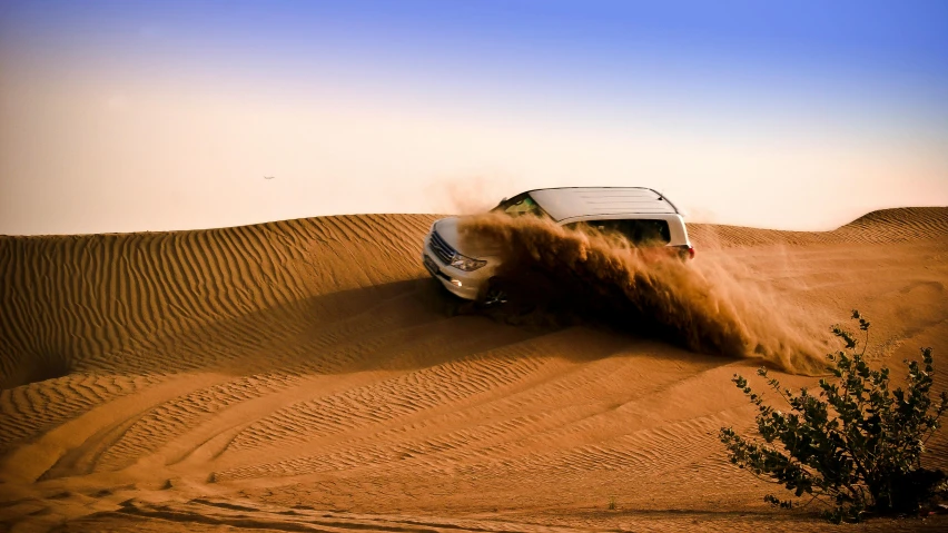 a car that is driving in the sand, in the middle of the desert, profile image, detailing, dramatic action shot