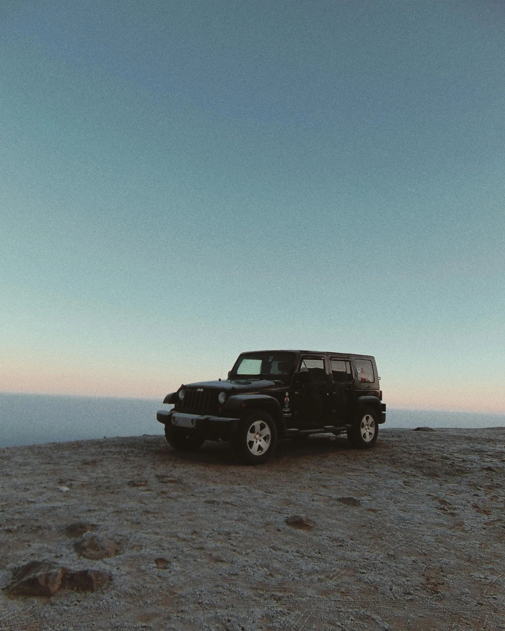 a black jeep parked on top of a mountain, pexels contest winner, romanticism, ☁🌪🌙👩🏾, profile image, late summer evening, minimalistic aesthetics