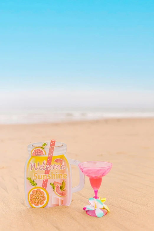 a pink drink sitting on top of a sandy beach, a picture, product display photograph, pink and yellow, banner, product shot