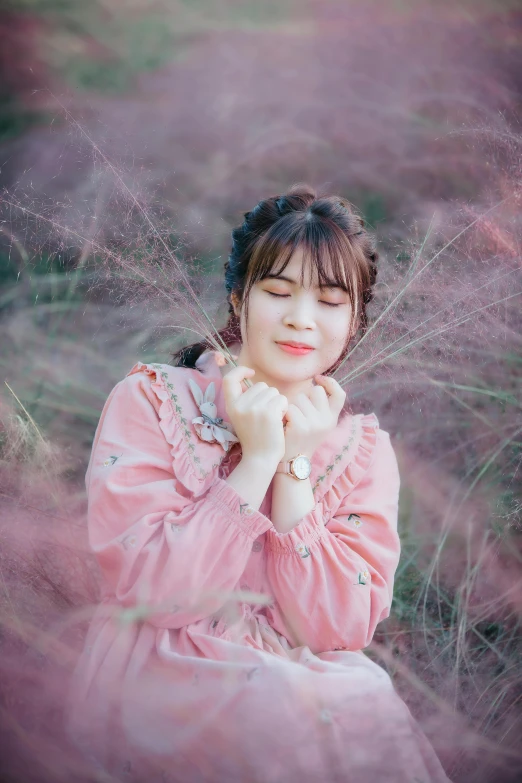 a woman in a pink dress sitting in a field, inspired by Kim Jeong-hui, pexels contest winner, soft round face, avatar image, ulzzang, headshot profile picture