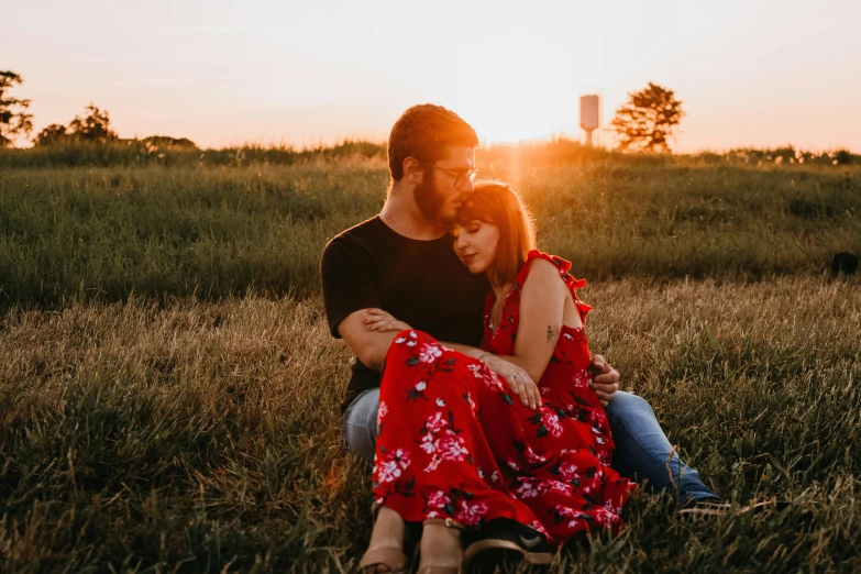 a man and woman sitting in a field at sunset, pexels contest winner, wearing a red sundress, avatar image, attractive photo, attractive man