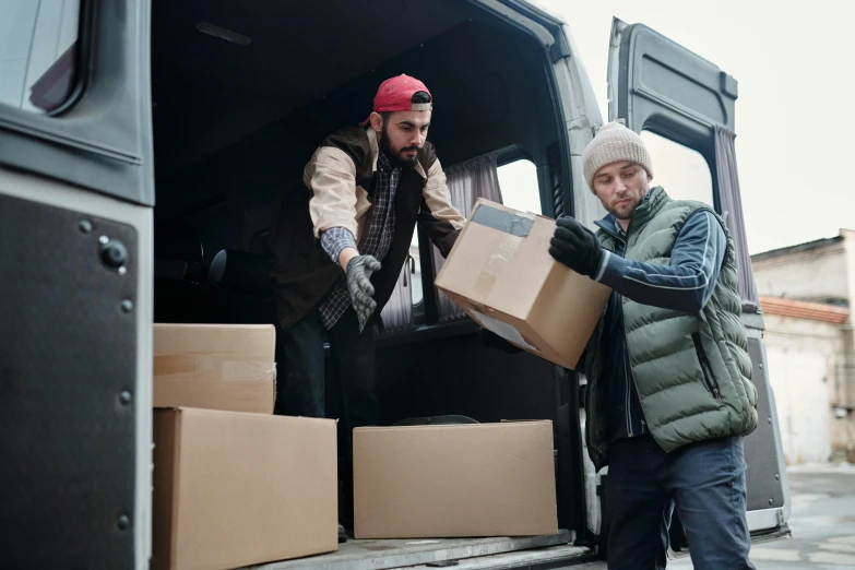 two men loading boxes into the back of a van, shutterstock, seasonal, thumbnail, 10k, warm