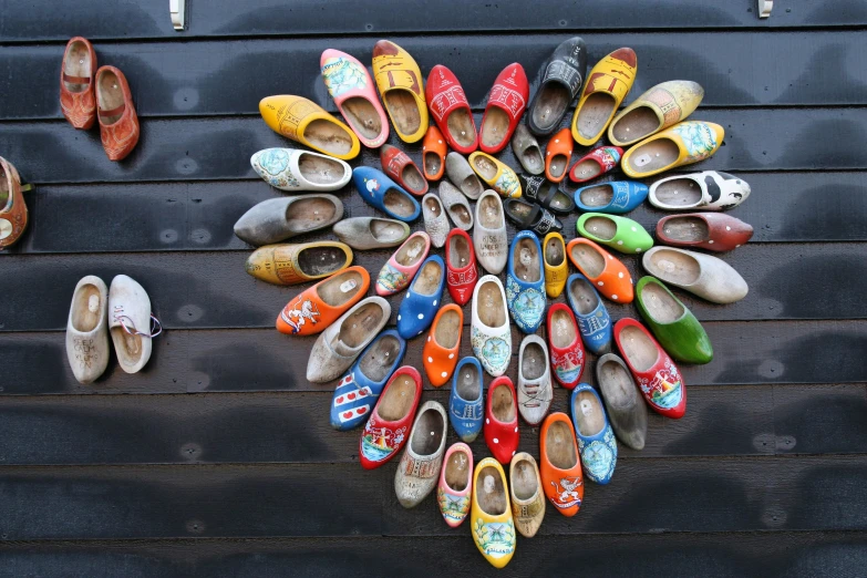 many pairs of shoes are arranged in the shape of a heart, a photo, by Michiel van Musscher, pexels contest winner, cloisonnism, cottagecore hippie, reykjavik, finely painted, an intricate