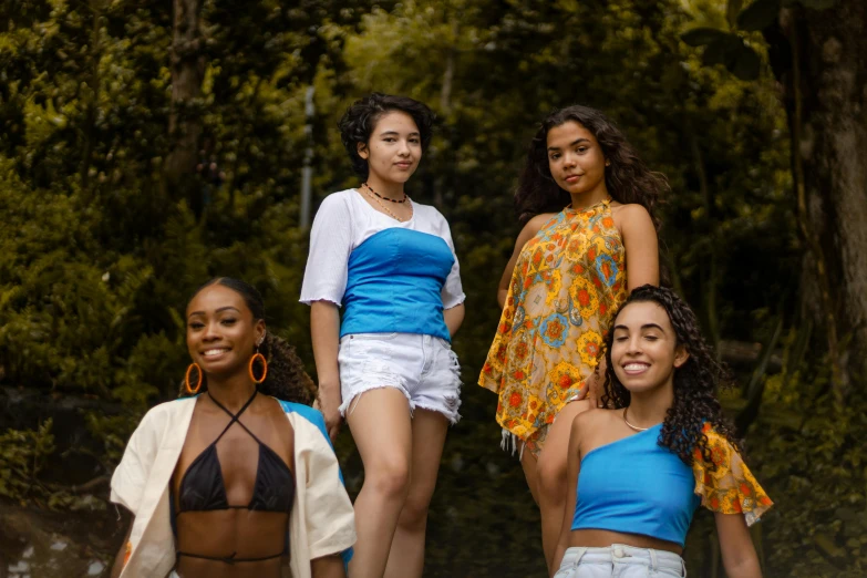 a group of young women standing next to each other, by Lily Delissa Joseph, pexels, happening, modeling for dulce and gabanna, avatar image, summertime, wearing blue