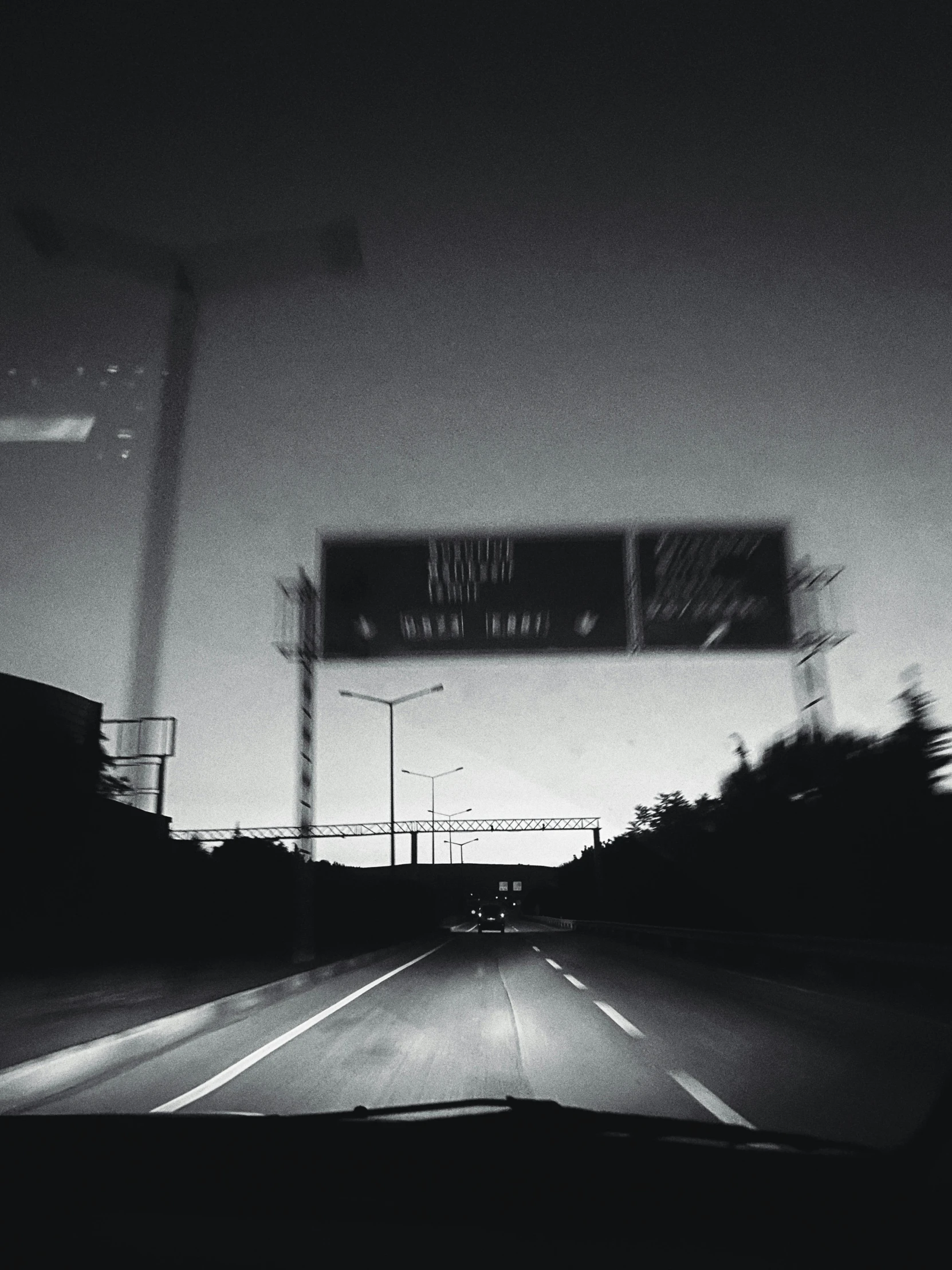 a black and white photo of a street sign, realism, wet highway chase, dark ambient album cover, instagram photo, enter night