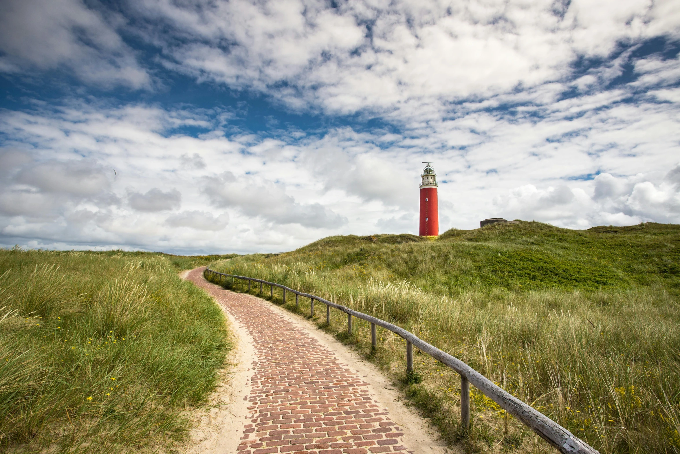 a path leading to a red and white lighthouse, by Matthias Stom, pexels contest winner, utrecht, square, wide greenways, thumbnail