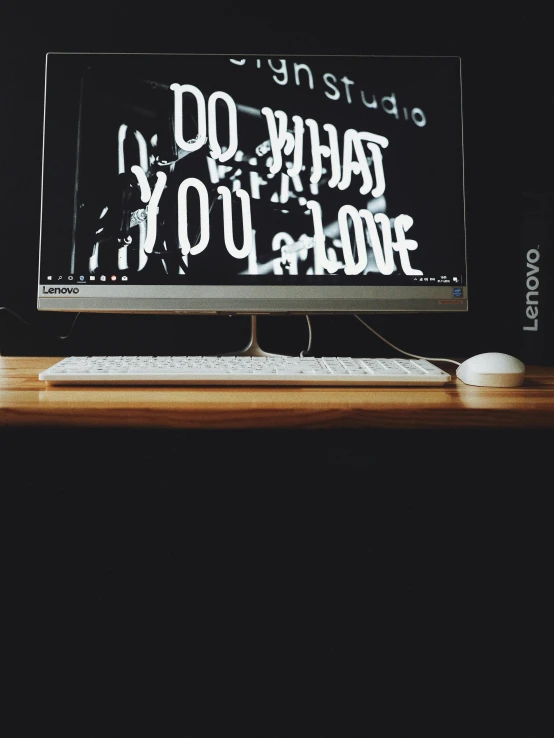 a computer monitor sitting on top of a wooden desk, a picture, by Robbie Trevino, unsplash, typographical experiments, portrait photo, pinterest wallpaper, ((intricate))