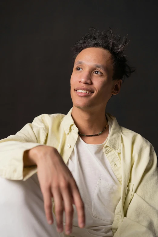 a man in a yellow shirt and white pants, unsplash, portrait of maci holloway, non-binary, peter chan, official photo