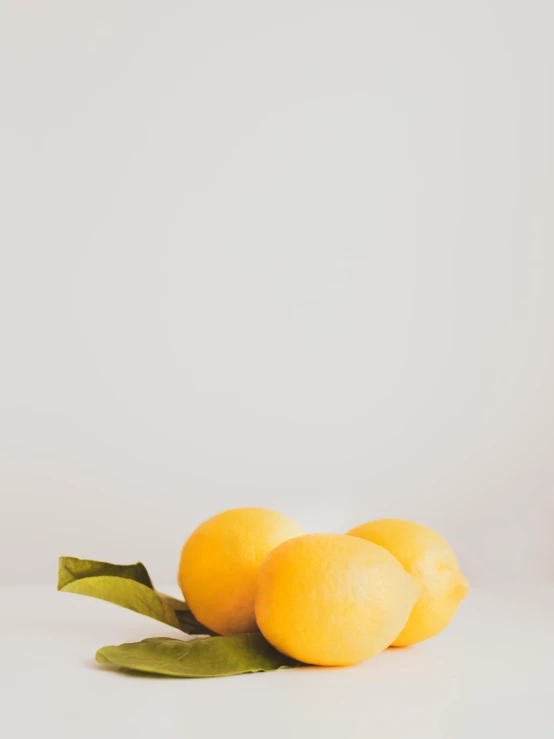 a couple of lemons sitting on top of a table, detailed product image, jovana rikalo, low quality photo, dwell