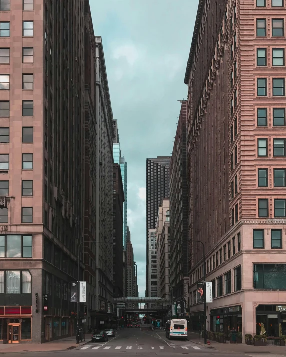 a city street filled with lots of tall buildings, a photo, pexels contest winner, location [ chicago ( alley ) ], color photo, high resolution photo, multiple stories