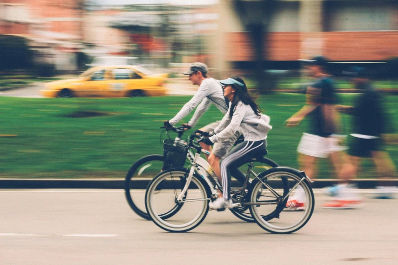 a person riding a bike on a city street, 2 people, avatar image, telephoto shot, random content