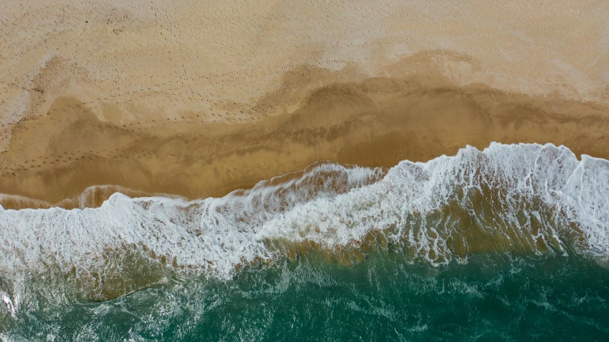 a large body of water next to a sandy beach, inspired by Andreas Gursky, pexels contest winner, renaissance, 4k —height 1024 —width 1024, ocean spray, photo 8 k, surf photography