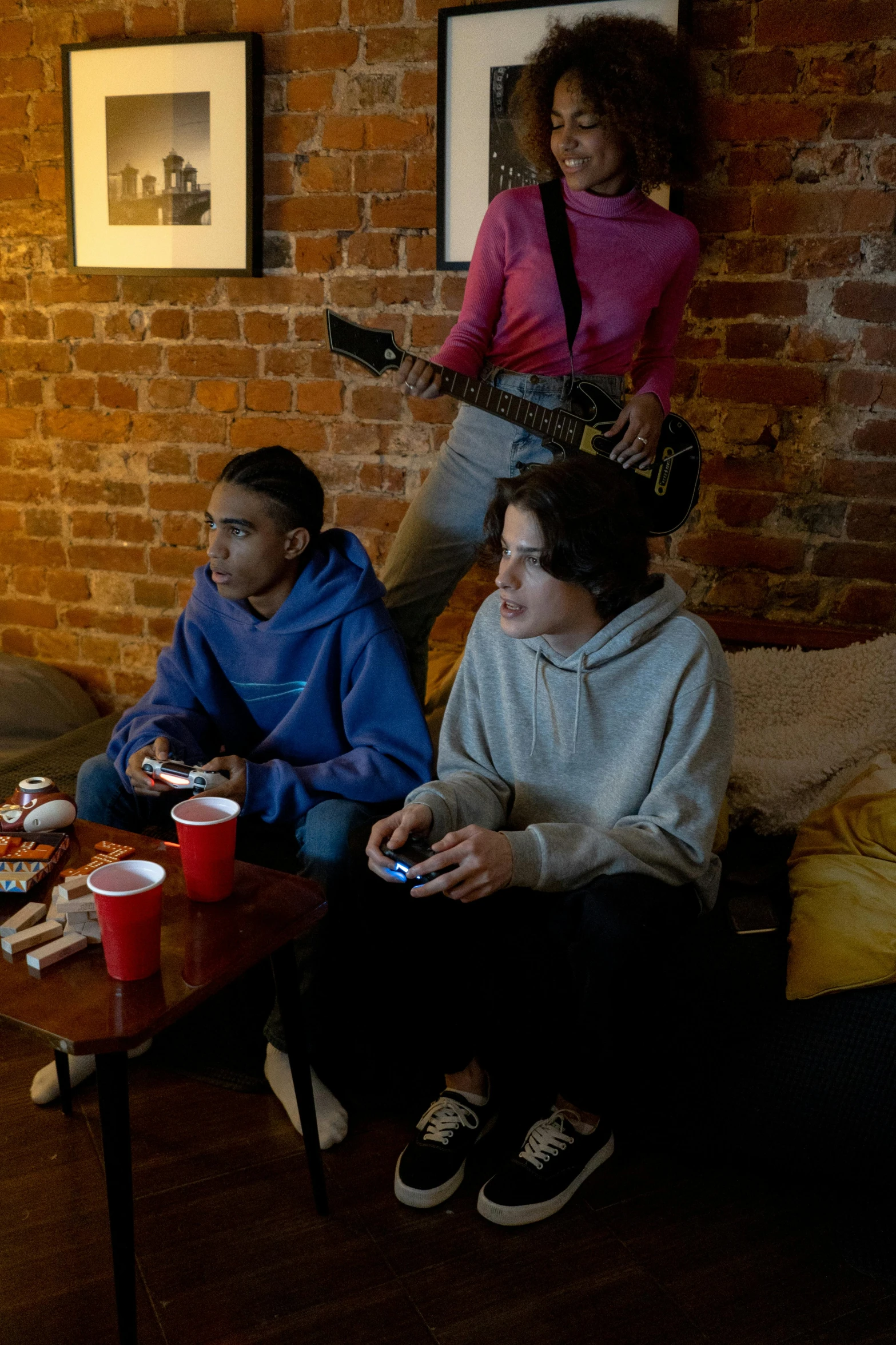 a group of people sitting on top of a couch, playing games, zoey frank, ap news photograph, slide show