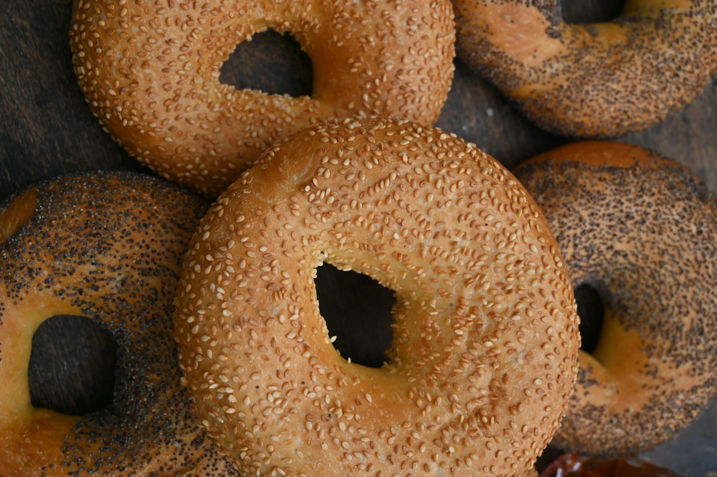 a bunch of bagels sitting on top of a table, background image, brown holes, avatar image, round-cropped