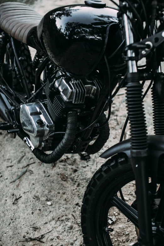 a black motorcycle parked on the side of the road, pexels contest winner, white mechanical details, corrugated hose, super detailed image, exploration