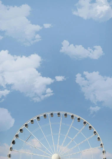 a ferris wheel in front of a cloudy blue sky, poster art, by Winona Nelson, 2022 photograph, conde nast traveler photo