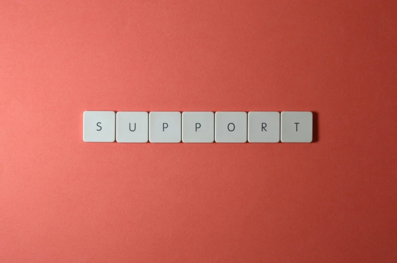 the word support spelled in scrabbles on a red background, by Emma Andijewska, trending on pexels, on a gray background, computer setup, instagram post, suicide