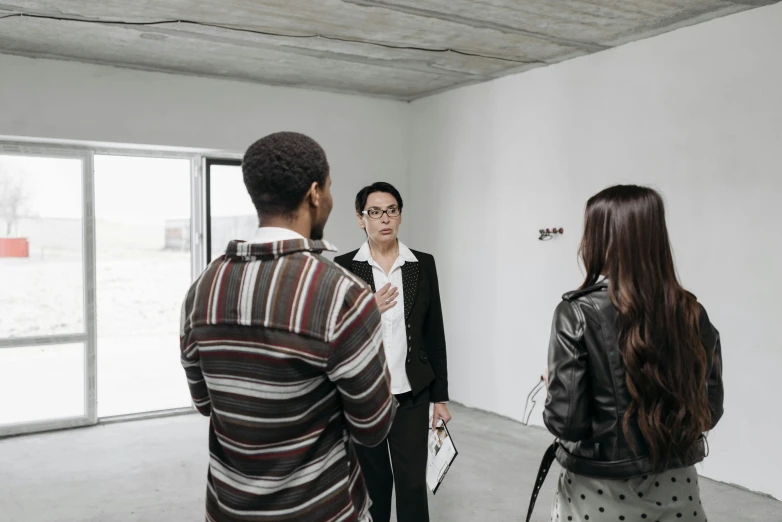 a group of people standing in a room, visual art, helmut lang, apartment of an art student, looking at each other mindlessly, liang mark