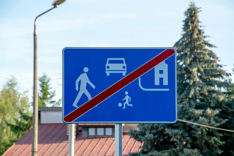 a blue street sign sitting on the side of a road, by Adam Marczyński, unsplash, hypermodernism, people fleeing, pictogram, in legnica, no text