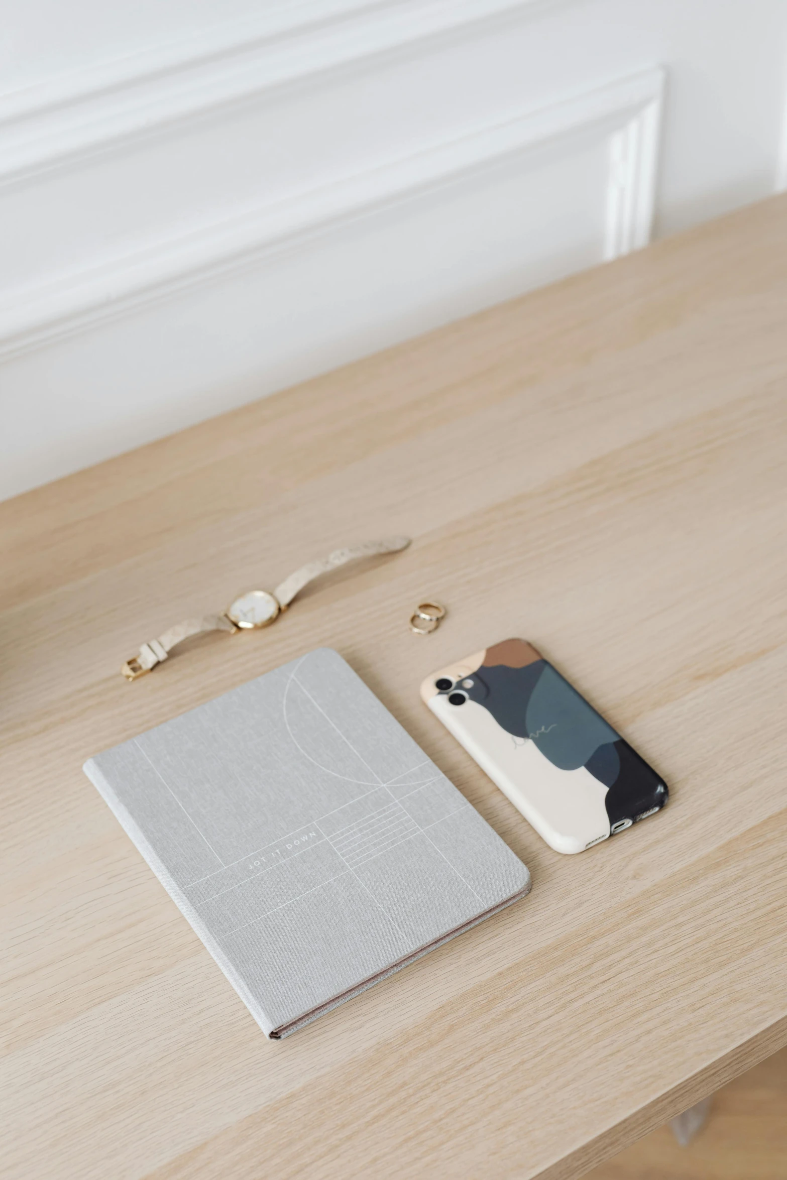 a laptop computer sitting on top of a wooden desk, by Andries Stock, trending on pexels, minimalism, phone wallpaper. intricate, light grey blue and golden, off - white collection, dwell