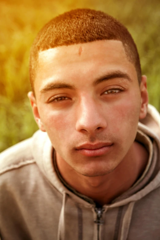 a close up of a person wearing a hoodie, shutterstock contest winner, renaissance, perfect face and boy, moroccan, lgbtq, in the sun