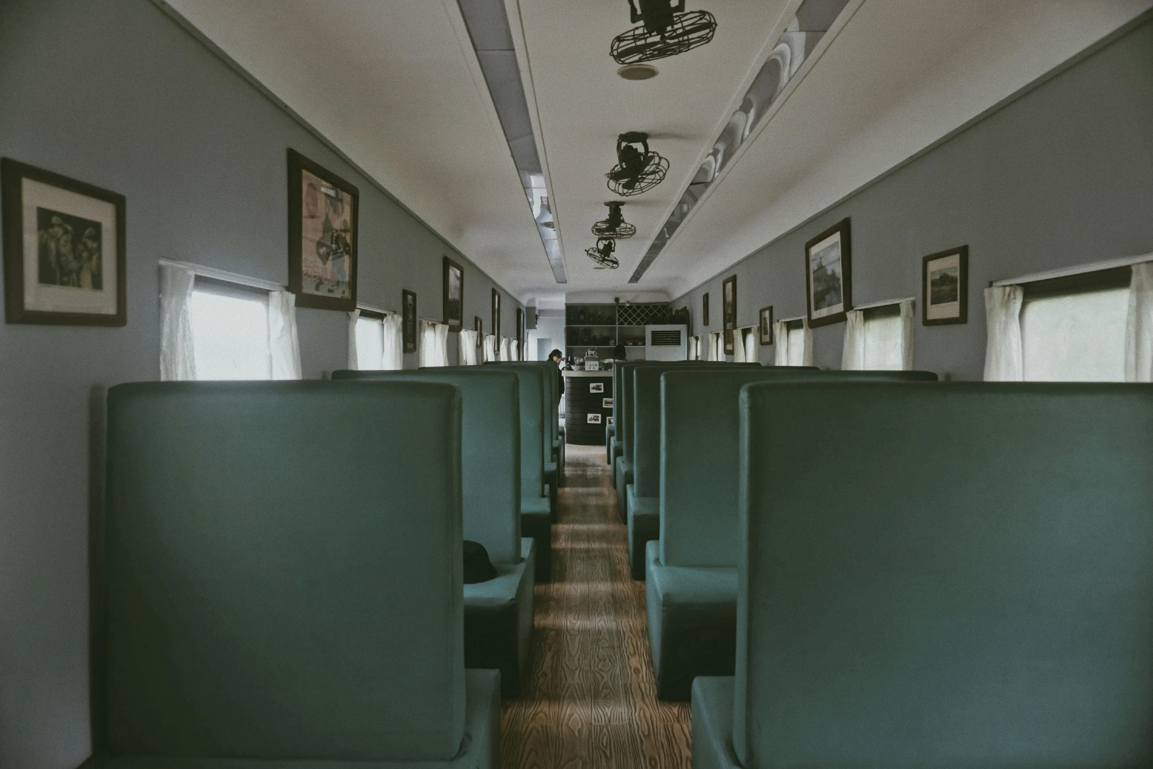 a view of the inside of a train car, a colorized photo, inspired by Wes Anderson, unsplash contest winner, ignant, 1 9 2 0 s furniture, photo of a classroom, gopro photo