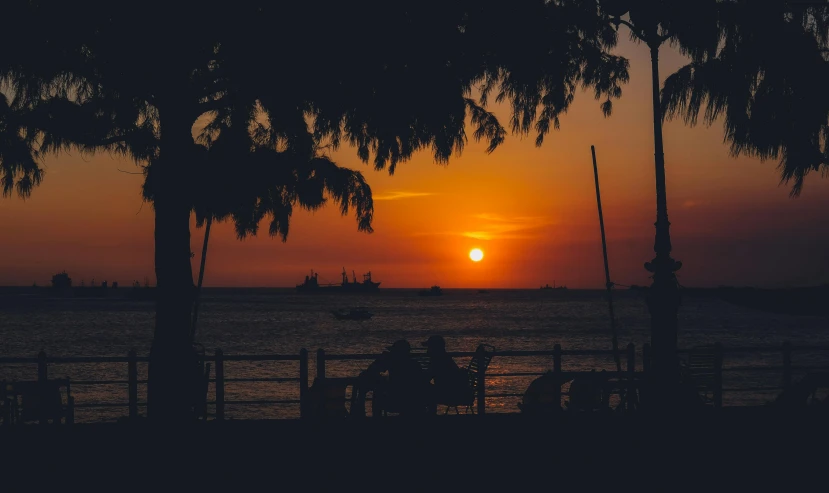 the sun is setting over a body of water, a picture, by Robbie Trevino, pexels contest winner, afternoon hangout, tropical atmosphere, thumbnail, brown