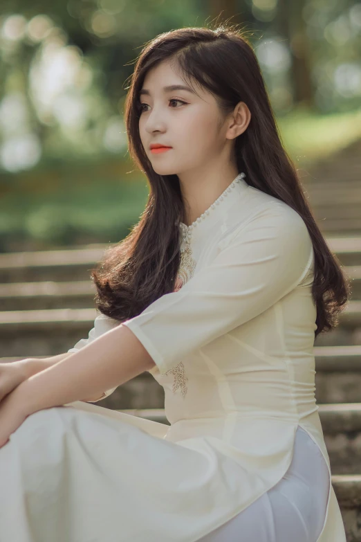 a woman in a white dress sitting on some steps, inspired by Qian Gu, pexels contest winner, realism, ao dai, square, girl cute-fine-face, wearing casual clothing