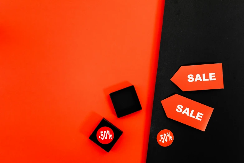 a black tie sitting on top of a red surface, by Julia Pishtar, trending on unsplash, orange safety labels, sales, square shapes, 3 - piece