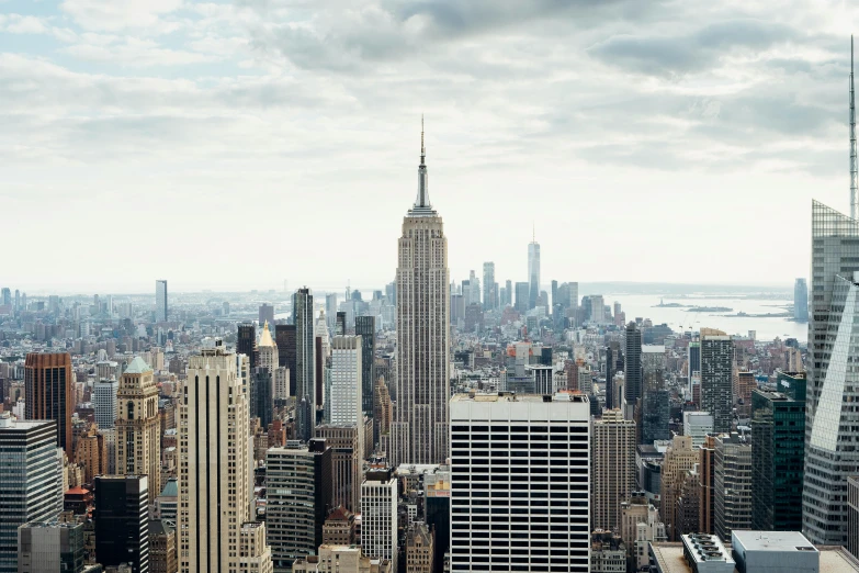 a view of a city from the top of a building, inspired by Thomas Struth, pexels contest winner, empire state building, fine art print, grey, extra high resolution