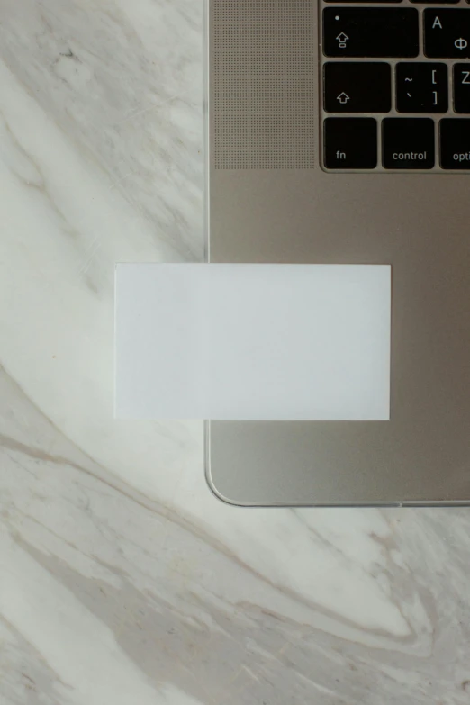 a laptop computer sitting on top of a marble table, minimalist sticker, whole card, white: 0.5, no - text no - logo