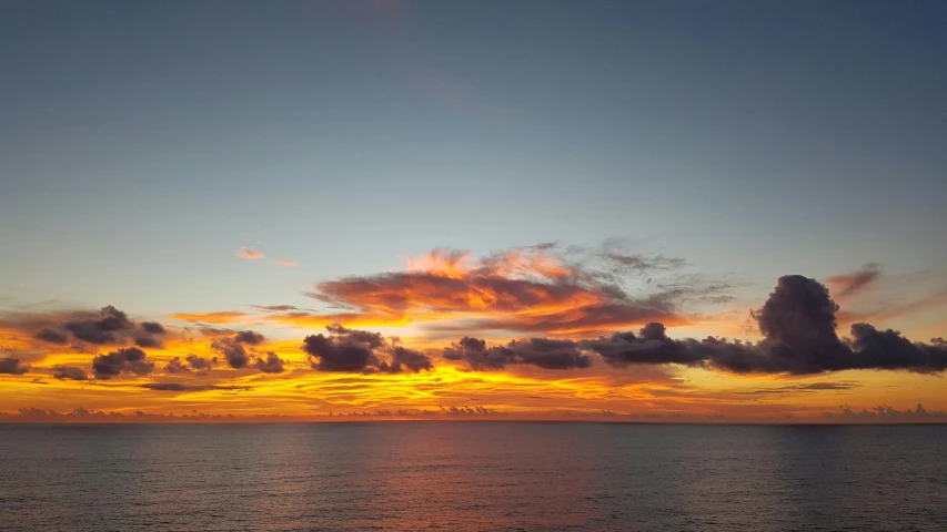 a large body of water with a sunset in the background, by Carey Morris, pexels contest winner, panorama view of the sky, puerto rico, high resolution, gulf of naples