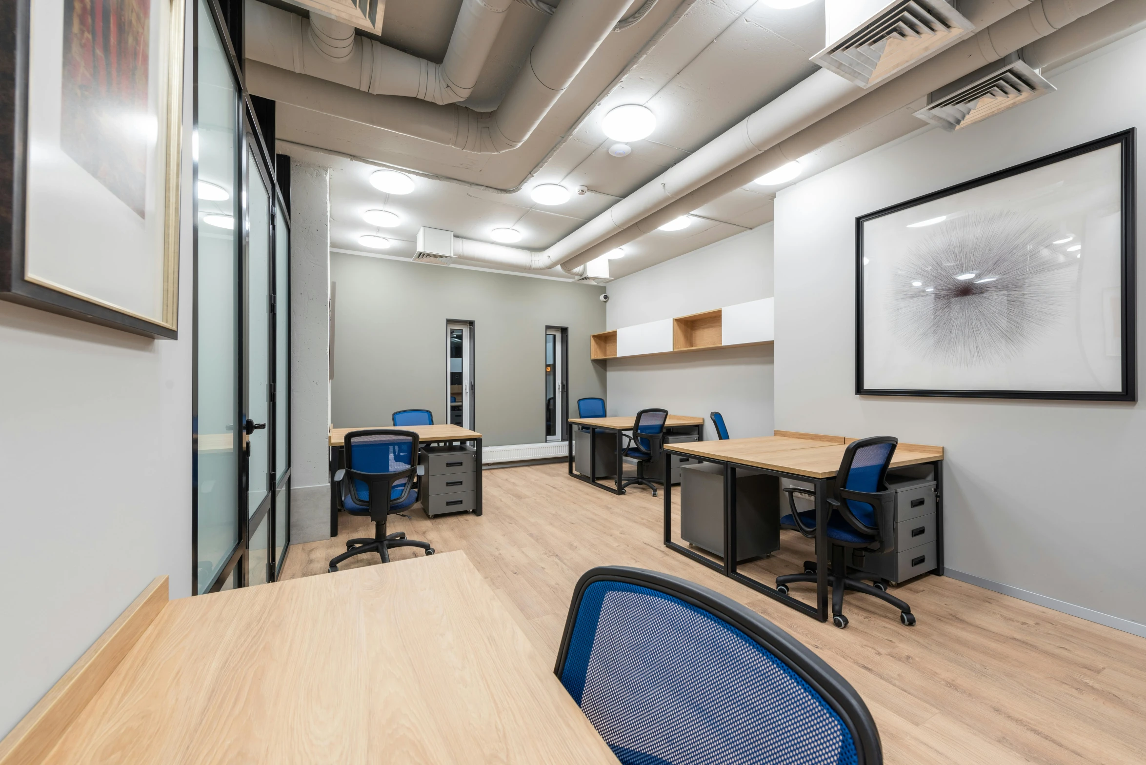 a conference room with desks and chairs, private press, swanland, thumbnail, multiple desks, central hub